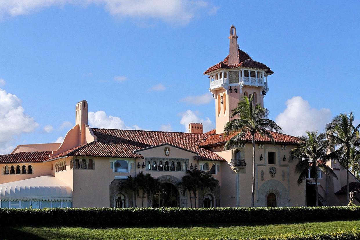 The Mar-a-Lago resort, showing its tower and surrounding palm trees. 