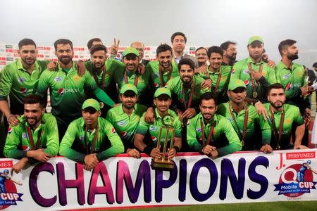Pakistani cricket team celebrate with the trophy after winning the third and final Twenty20 cricket match against Sri Lanka in Lahore, Pakistan October 29, 2017. REUTERS/Mohsin Raza/Files