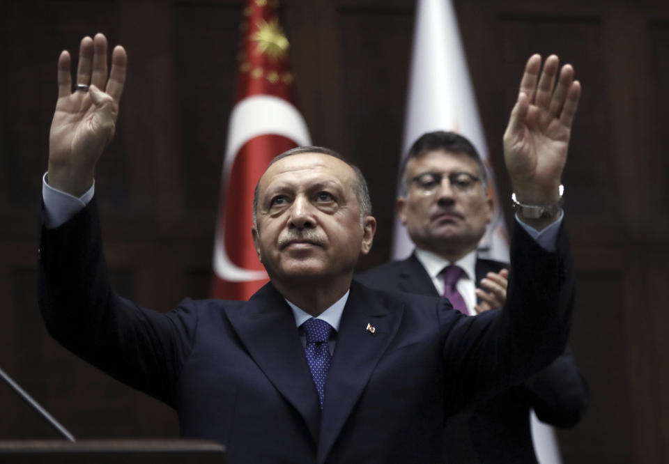 FILE - In this Wednesday, Oct 16, 2019 file photo, President Recep Tayyip Erdogan addresses his ruling party legislators at the Parliament in Ankara, Turkey. During the 2020 U.S. presidential campaign, Joe Biden drew ire from Turkish officials after an interview with The New York Times in which he called Erdogan an “autocrat.” (AP Photo/Burhan Ozbilici, File)