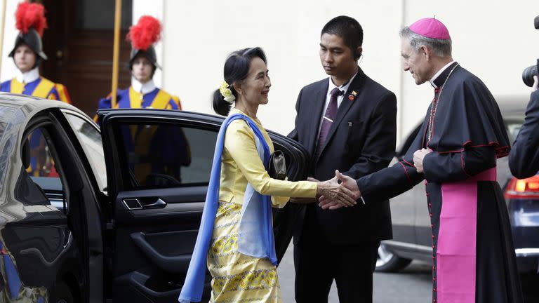 State Counsellor and Union Minister for Foreign Affairs of the Republic of the Union of Myanmar Aung San Suu Kyi, left, is welcomed by Prefect of the Pontifical Household, Archbishop Georg Ganswein, upon her arrival at the Vatican for a private audience with Pope Francis, Thursday, May 4, 2017. Vati