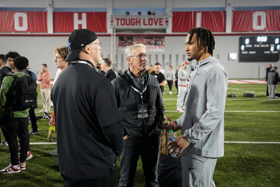 Ohio State quarterback C.J. Stroud (right) talkes to Seahawks coach Pete Carroll (middle) at the Buckeyes' 2023 pro day.