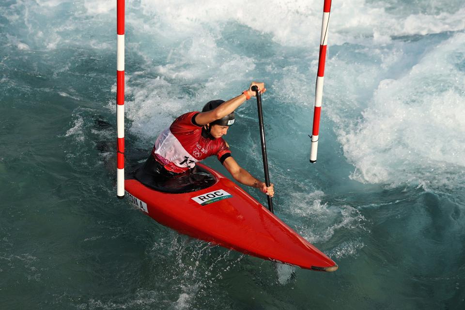 Russia's Alsu Minazova trains at the Kasai Canoe Slalom Centre on July 22. The "ROC" acronym is visible on his kayak.