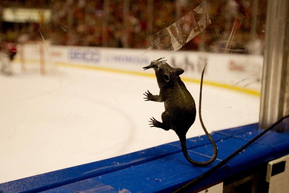 A fans rat sticks to the glass in the second period of the playoff game between the Florida Panthers and the New Jersey Devils at Bank Atlantic Center in Sunrise on April 13,2012.