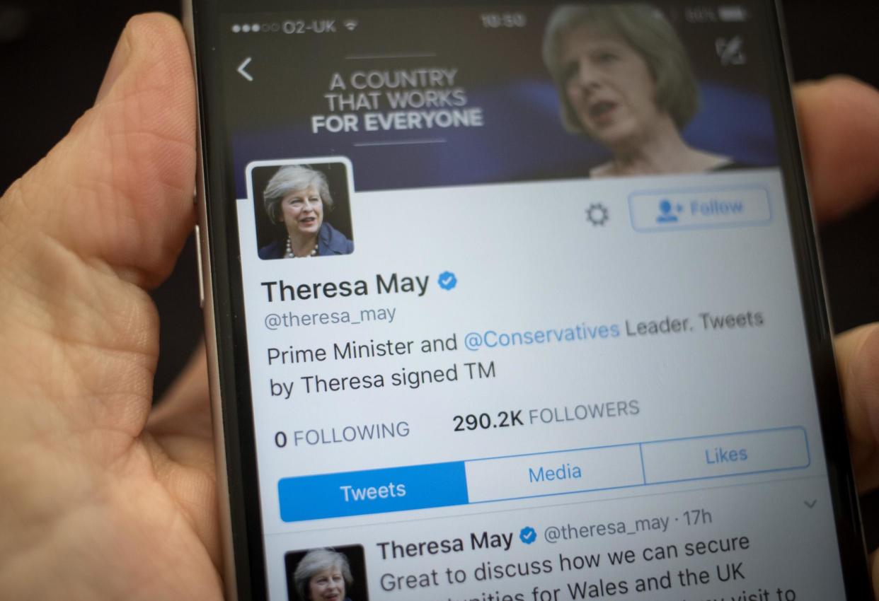 This photo illustration shows the Twitter page for Prime Minister Theresa May on an iPhone on 26 April 2017 in Bristol: Getty