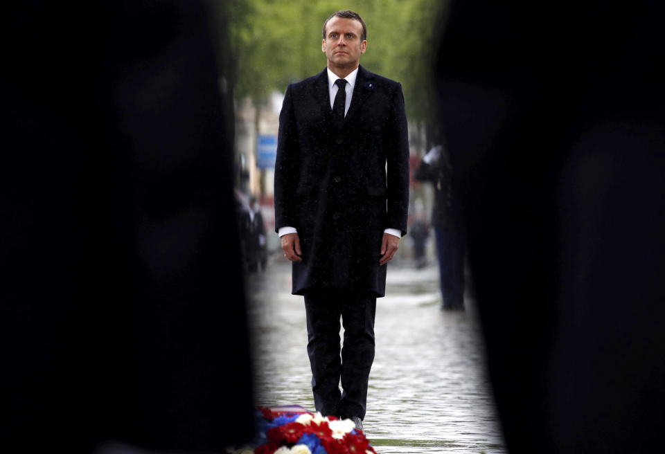 French President Emmanuel Macron attends a wreath laying ceremony to mark the 74th anniverssary of World War II victory in Europe, under the Arc de Triomphe Wednesday May 8, 2019 in Paris . (Christian Hartmann, Pool via AP)