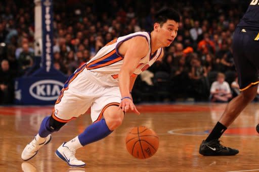 File photo shows Jeremy Lin playing for the New York Knicks in New York in March. Lin's sparkling Broadway run is over, but the point guard who took New York by storm says he is excited to launch the next phase of his NBA career with the Houston Rockets