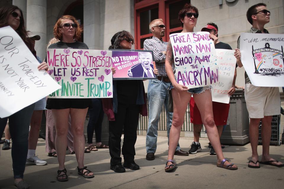 Demonstrators outside of the Dayton City Hall protest a planned visit of President Donald Trump on August 06, 2019 in Dayton, Ohio. Trump was scheduled to visit the city on Wednesday as residents recover from Sunday Morning's mass shooting in the Oregon District.