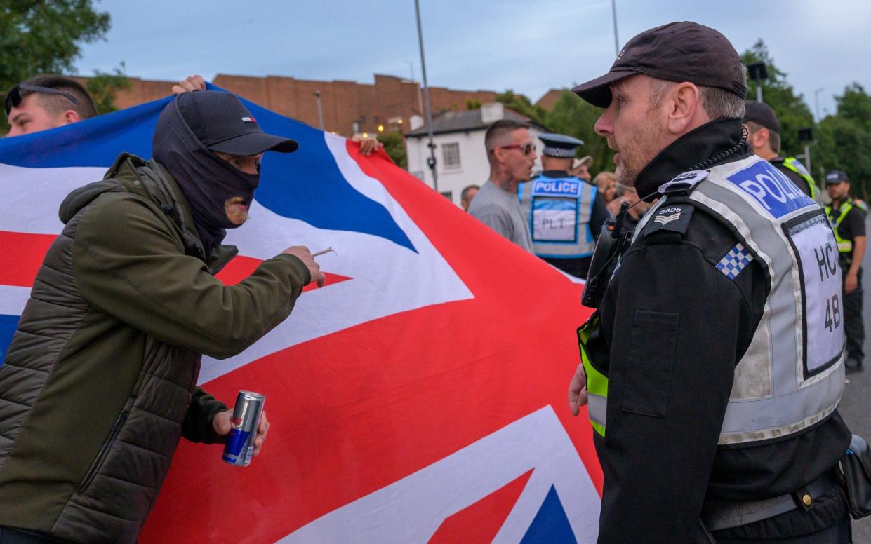 Police move on protesters outside the Border Force Headquarters in Portsmouth