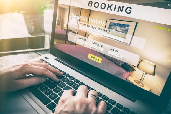 A person makes a booking for a hotel room online.