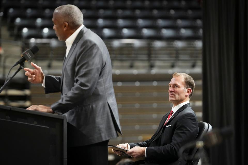 Jan 17, 2024; Columbus, OH, USA; Ross Bjork listens as Ohio State athletic director Gene Smith speaks at a press conference to name Bjork his successor at the Covelli Center.