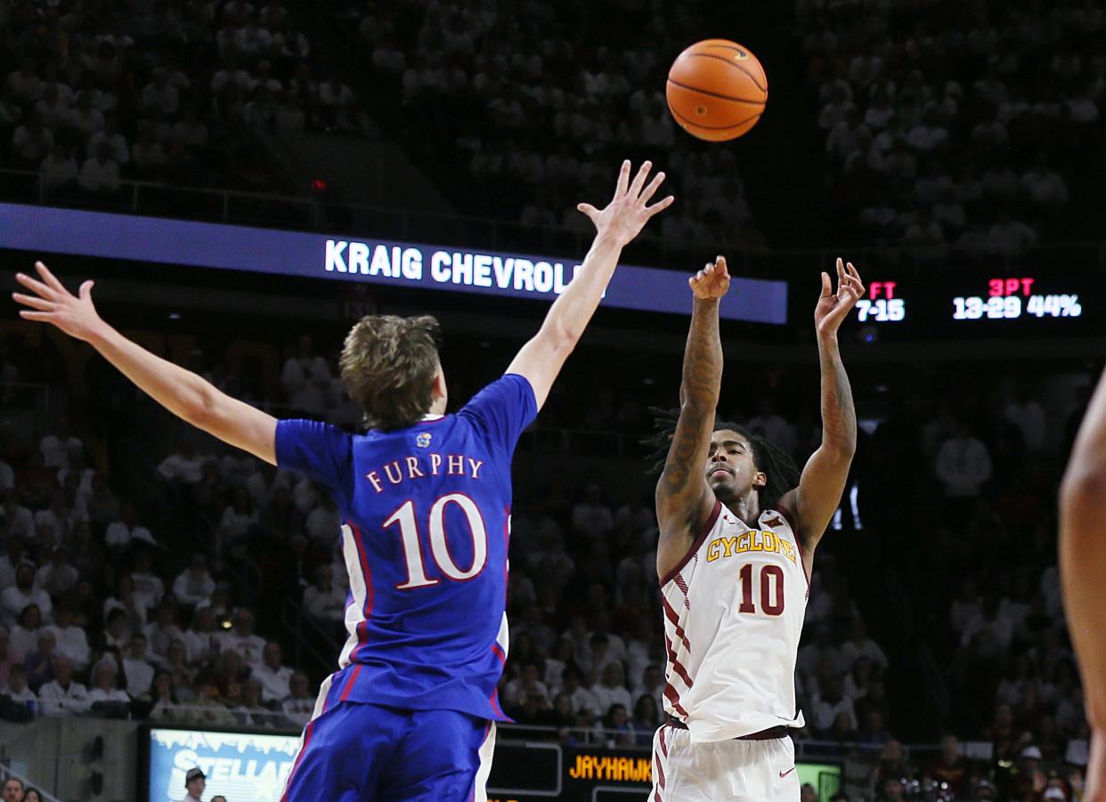 Iowa State Cyclones guard Keshon Gilbert (10) takes a 3-point shot over Kansas Jayhawks guard Johnny Furphy. Gilbert had 16 points in the upset win on Saturday.