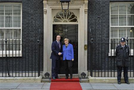 Britain's Prime Minister David Cameron greets German Chancellor Angela Merkel at Number 10 Downing Street in London February 27, 2014. REUTERS/Toby Melville