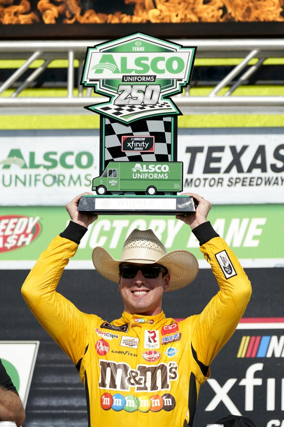 Kyle Busch celebrates after winning a NASCAR Xfinity Series auto race at Texas Motor Speedway in Fort Worth, Texas, Saturday, June 12, 2021. (AP Photo/Tony Gutierrez)