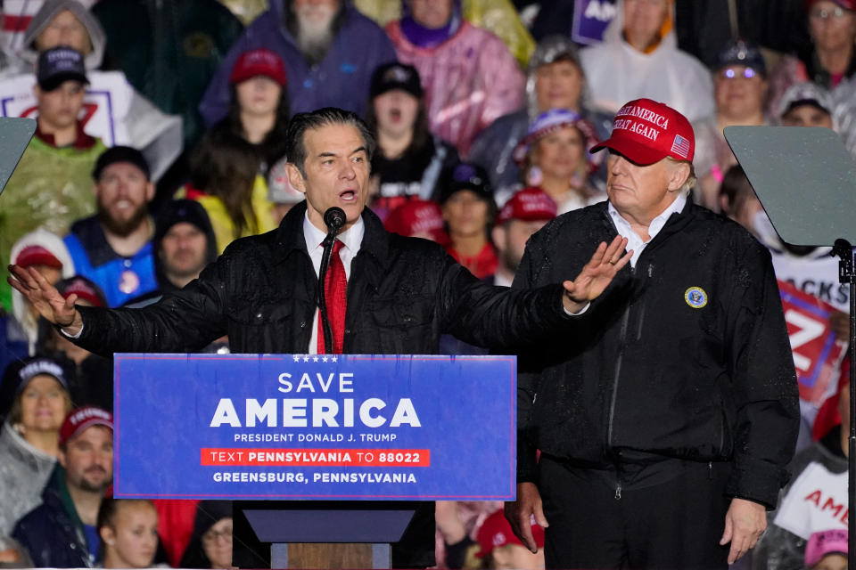 Pennsylvania Senate candidate Mehmet Oz, left, accompanied by former President Donald Trump, speaks at a campaign rally in Greensburg, Pa., Friday, May 6, 2022. (AP Photo/Gene J. Puskar)