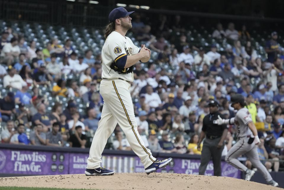 Milwaukee Brewers starting pitcher Corbin Burnes reacts after giving up a two-run home run to Arizona Diamondbacks' Alek Thomas during the first inning of a baseball game Monday, June 19, 2023, in Milwaukee. (AP Photo/Morry Gash)