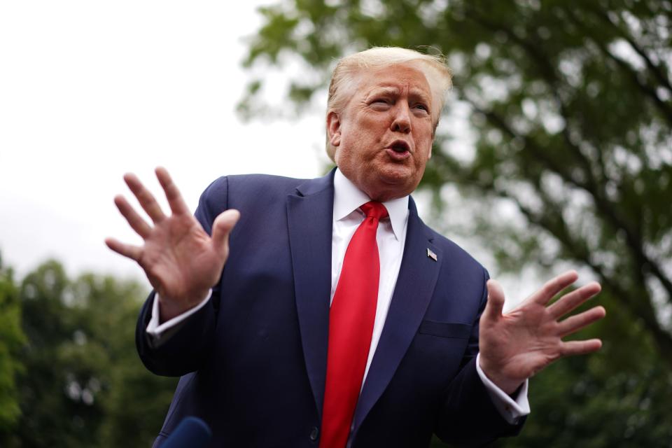 President Trump speaks to reporters he departs the White House in Washington, D.C., on Thursday. (Photo by Mandel Ngan/AFP via Getty Images)