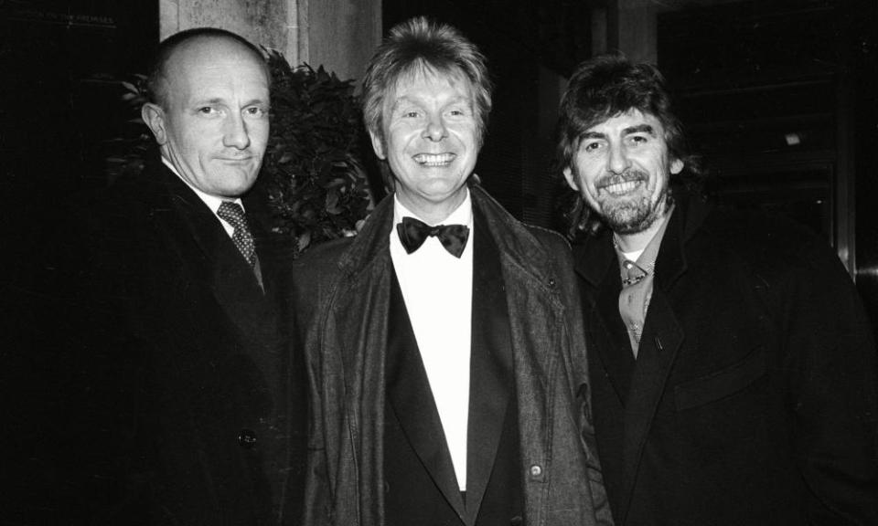 Ray Cooper, Joe Brown and George Harrison at Le Caprice in 1987.