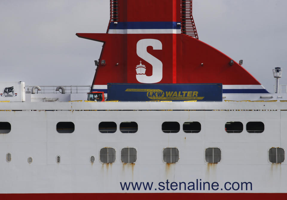 Trucks make their way onto a ferry in Hook of Holland terminal in the harbor of Rotterdam, Netherlands, Tuesday, Sept. 11, 2018. Gert Mulder of the Dutch Fresh Produce Center that supports some 350 traders and growers associations fears the worst if negotiators trying to hammer out a Brexit deal fail. One truck driver showing up at the docks without the proper paperwork "could throw it all into chaos," he says. (AP Photo/Peter Dejong)