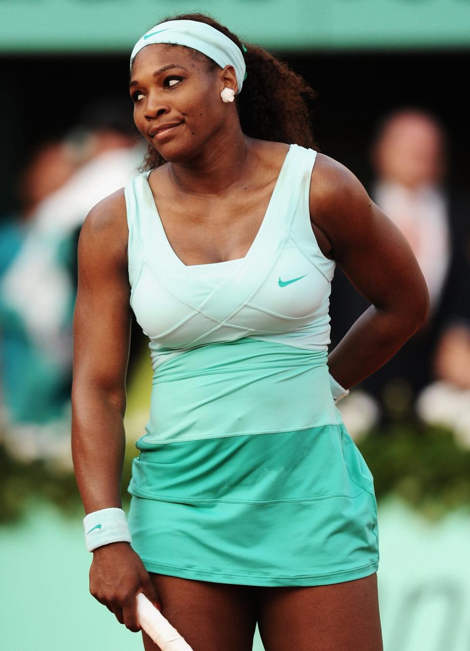 Serena Williams of USA shows her frustration during her women's singles first round match between Serena Williams of USA and Virginie Razzano of France during day three of the French Open at Roland Garros on May 29, 2012 in Paris, France