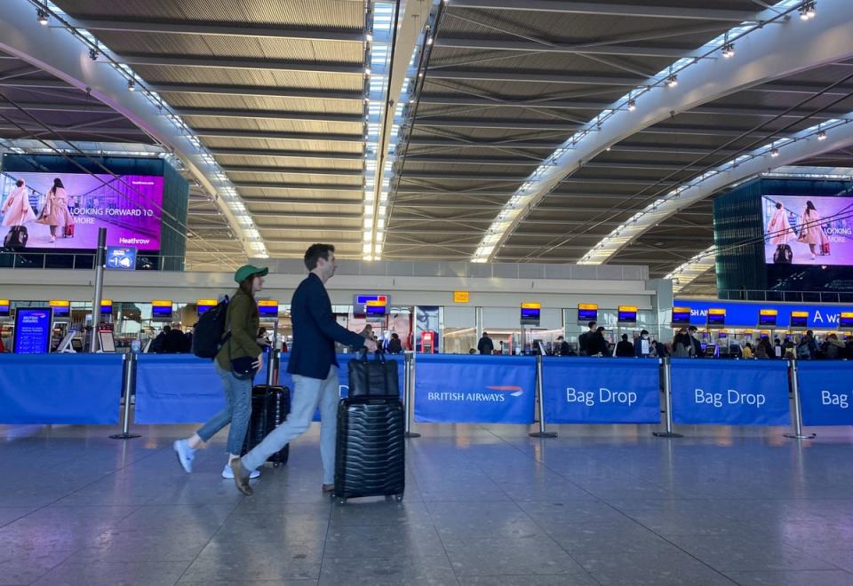 Passengers checking in at Heathrow’s Terminal 5 as schools closed for Easter last year (PA)