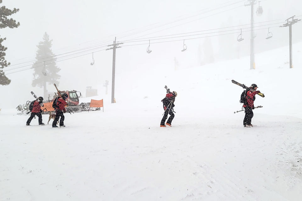 Image: Rescues crews work at the scene of an avalanche at the Palisades Tahoe ski resort (Mark Sponsler via AP)