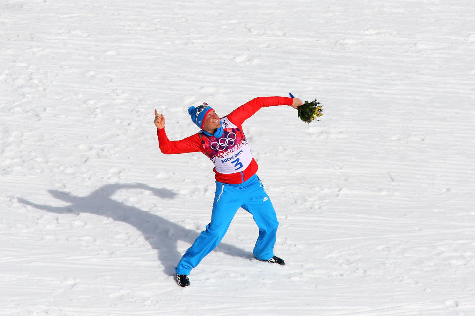 SOCHI, RUSSIA - FEBRUARY 23:  Gold medalist Alexander Legkov of Russia celebrates during the flower ceremony for the Men's 50 km Mass Start Free during day 16 of the Sochi 2014 Winter Olympics at Laura Cross-country Ski & Biathlon Center on February 23, 2014 in Sochi, Russia.  (Photo by Alexander Hassenstein/Getty Images)