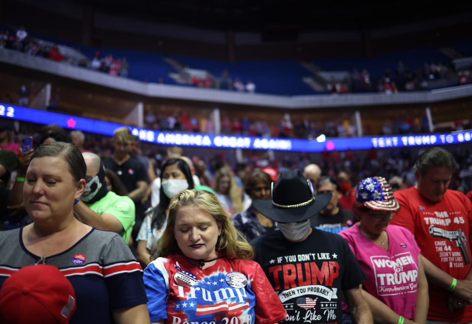 TULSA, OKLAHOMA - JUNE 20: Supporters participate in a prayer during a campaign rally for U.S. President Donald Trump at the BOK Center, June 20, 2020 in Tulsa, Oklahoma. Trump is holding his first political rally since the start of the coronavirus pandemic at the BOK Center on Saturday while infection rates in the state of Oklahoma continue to rise. (Photo by Win McNamee/Getty Images)