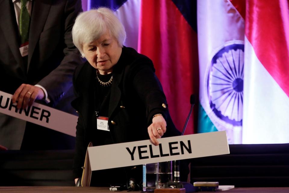 Janet Yellen  places her name plate at her seat at the International Monetary Conference in Shanghai, China, on June 3, 2013.  
