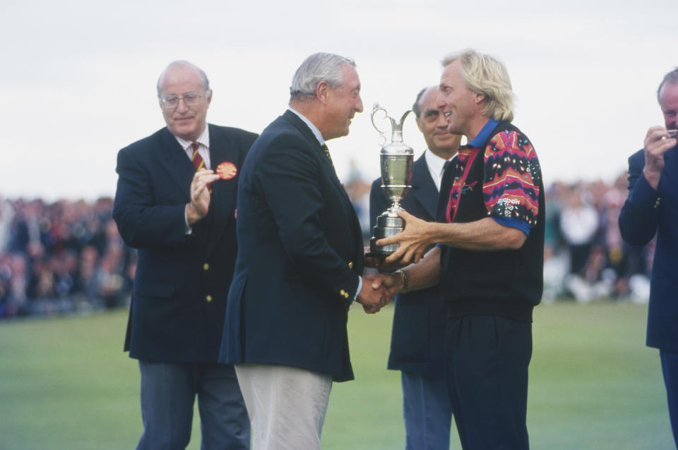 Greg Norman, pictured here receiving the Claret Jug after winning the 122nd Open Championship in 1993.