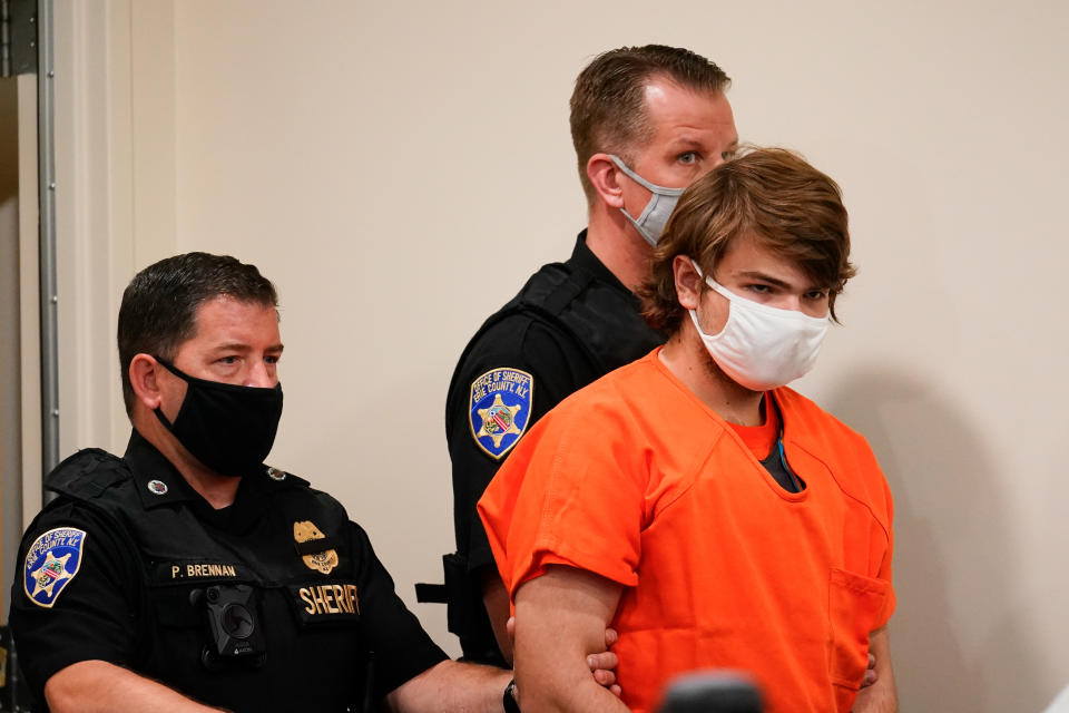 FILE - Payton Gendron is led into the courtroom for a hearing at Erie County Court in Buffalo, N.Y., on May 19, 2022. Gendron, a white gunman who targeted a Buffalo supermarket in a predominantly Black neighborhood, plans to plead guilty on Monday, Nov. 28, to killing 10 people and wounding three others, according to lawyers representing victims’ relatives. (AP Photo/Matt Rourke, File)