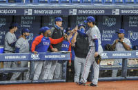 Texas Rangers greet starting pitcher Kohei Arihara at the dugout after he was pulled during the sixth inning against the Tampa Bay Rays in a baseball game Wednesday, April 14, 2021, in St. Petersburg, Fla. (AP Photo/Steve Nesius)