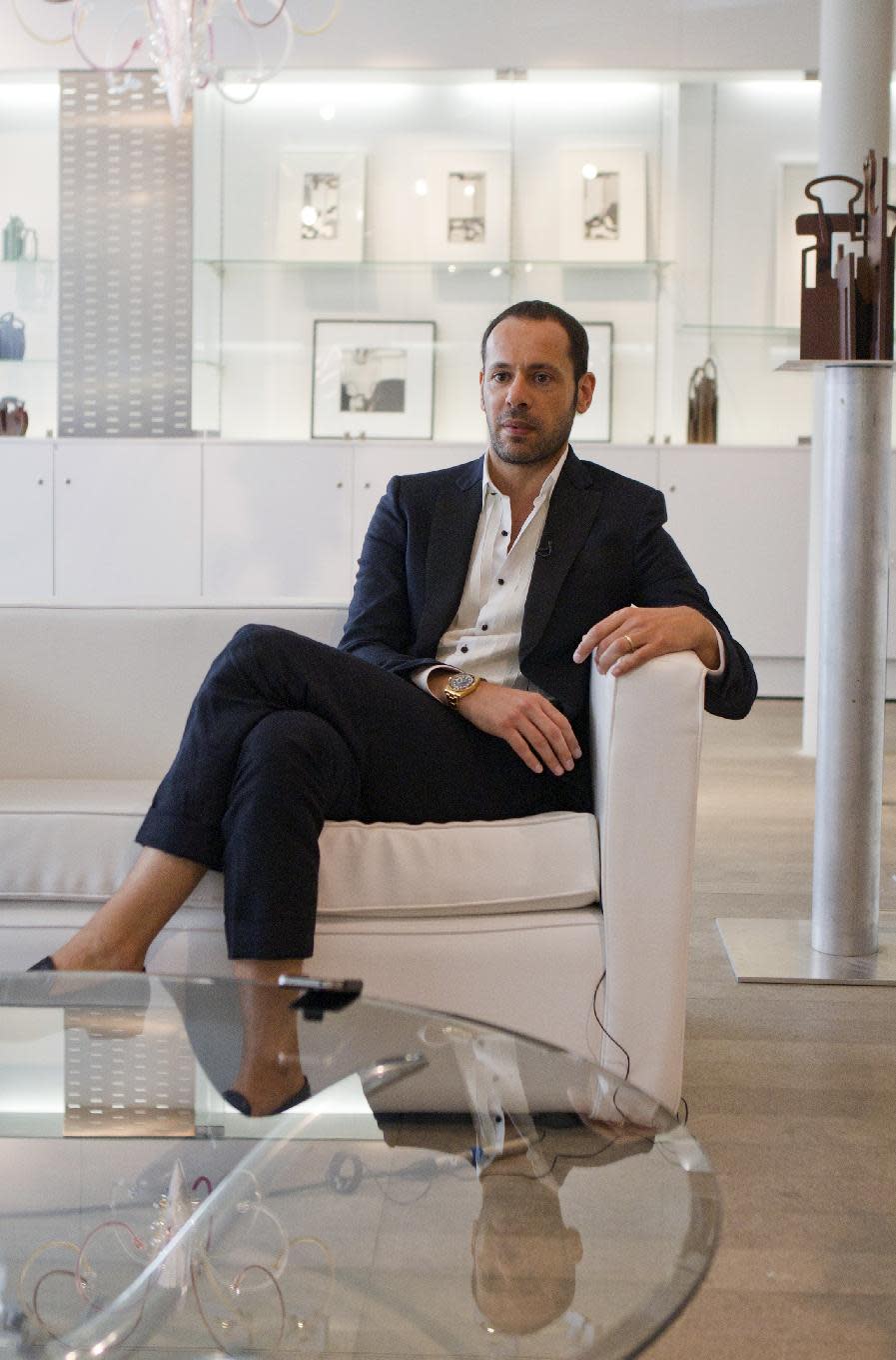 Salvatore Ferragamo's creative director, Massimiliano Giornetti, talks during an interview with the Associated Press, in Paris, Thursday, June 14, 2012. (AP Photo/Jacques Brinon)