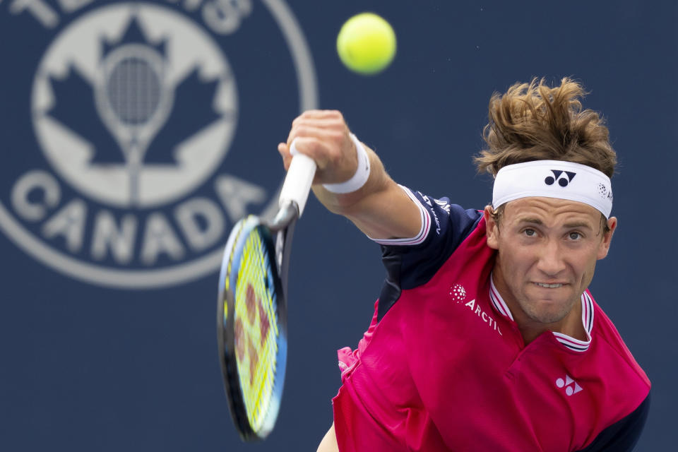 FILE - Casper Ruud, of Norway, serves to Alejandro Davidovich Fokina, of Spain, at the National Bank Open tennis tournament in Toronto, Thursday, Aug. 10, 2023. Ruud is one of the men to watch at the U.S. Open, which begins at Flushing Meadows on Aug. 28.(Frank Gunn/The Canadian Press via AP, File)