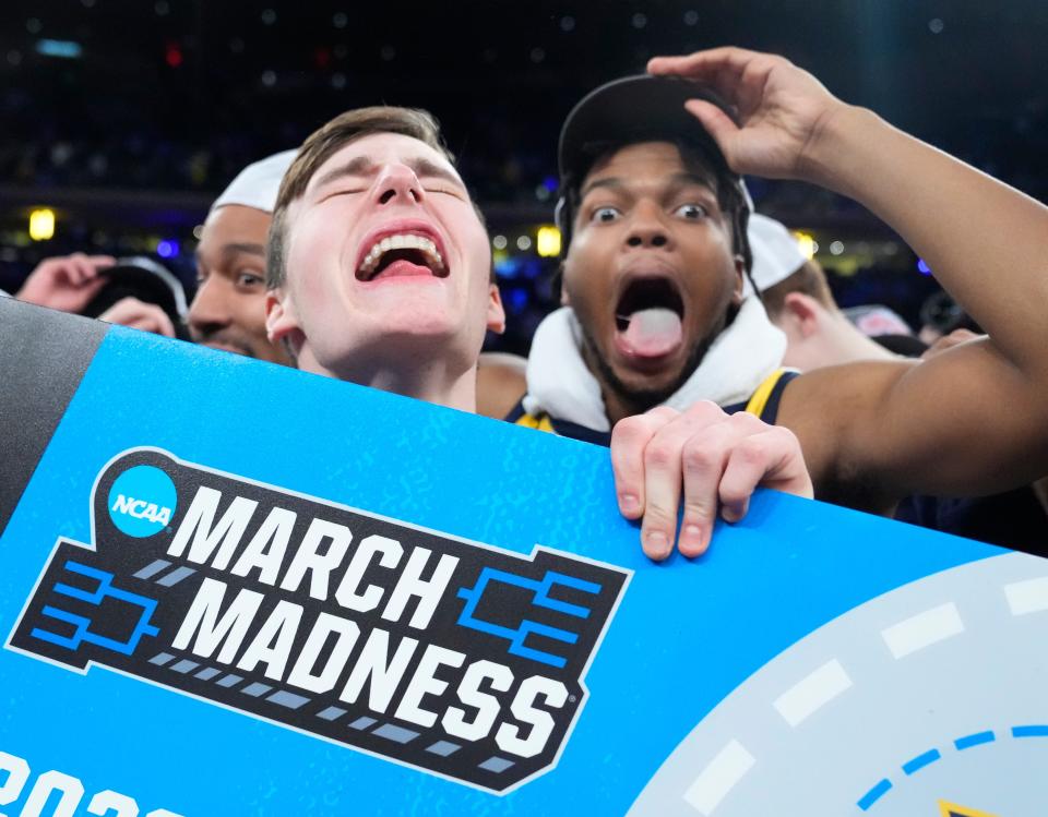 Marquette Golden Eagles guard Tyler Kolek, left, and forward David Joplin celebrate after defeating the Xavier Musketeers Saturday for the Big East tournament championship at Madison Square Garden in New York.