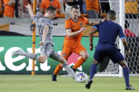 CF Montreal midfielder Lassi Lappalainen (21) takes a shot, scoring past Houston Dynamo defender Daniel Steres, middle, as referee Guido Gonzales Jr., right, watches during the second half of an MLS soccer match Saturday, Aug. 13, 2022, in Houston. (AP Photo/Michael Wyke)