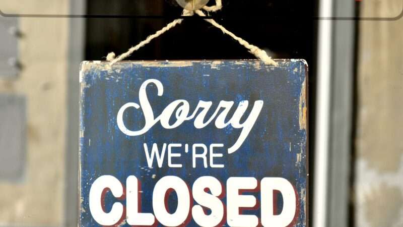 A sign reading 'Sorry we're closed'