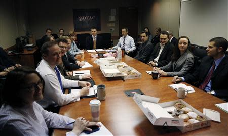 Office of Foreign Assets Control (OFAC) Director Adam Szubin and his staff meet at the U.S. Treasury Department in Washington March 26, 2014. REUTERS/Gary Cameron