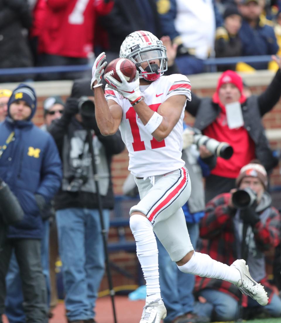 Ohio State receiver Chris Olave catches a touchdown against Michigan during the first half Saturday, Nov. 30, 2019 at Michigan Stadium.