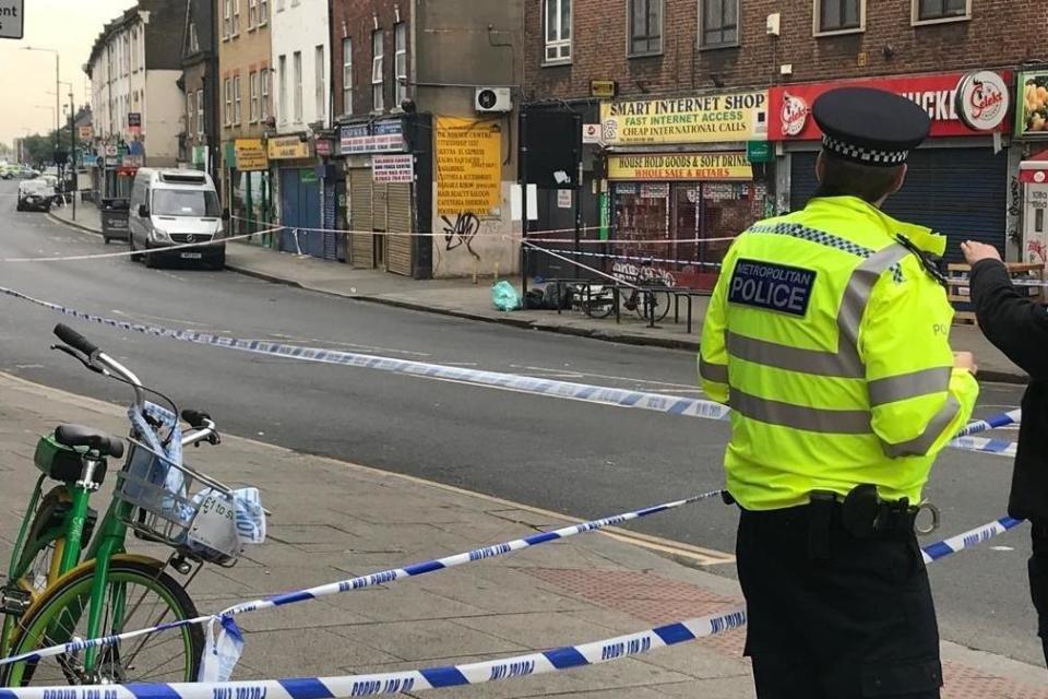 A police cordon on Harlesden High Street where a man was stabbed to death on Tuesday night