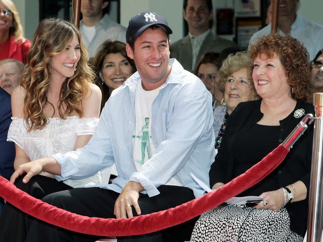 <p>Vince Bucci/Getty</p> Adam Sandler, wife Jackie and mother Judy Sandler outside the Mann's Chinese Theatre in 2005