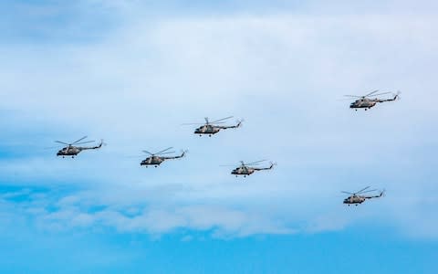 Russian military helicopters fly over the Chita region - Credit: Russian Defense Ministry Press Service