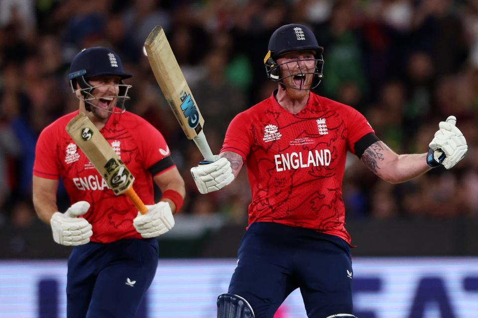 England's Ben Stokes, right, celebrates hitting the winning runs (AP)