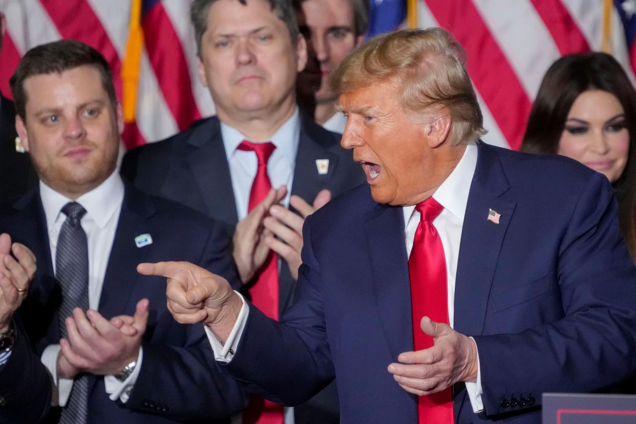 Former President Donald Trump points to the crowd as he leaves the podium Monday, Jan. 15, 2024, at the Trump caucus night watch party at the Iowa Events Center in Des Moines.