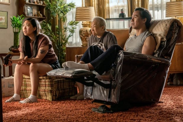 No shoes in the house. Nora (Awkwafina), Grandma (Lori Tan Chinn) and Wally (B.D. Wong).