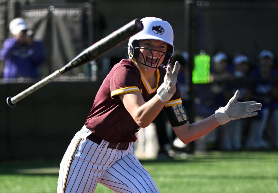 Bloomington North’s Molly Klein (9) celebrates after drawing a walk in the first inning during the softball game at Bloomington South on Wednesday, April 24, 2024.