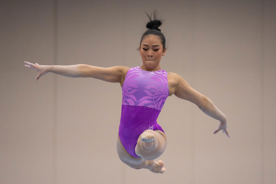 Suni Lee warms up on the balance beam for the Winter Cup competition on Feb. 23, 2024.