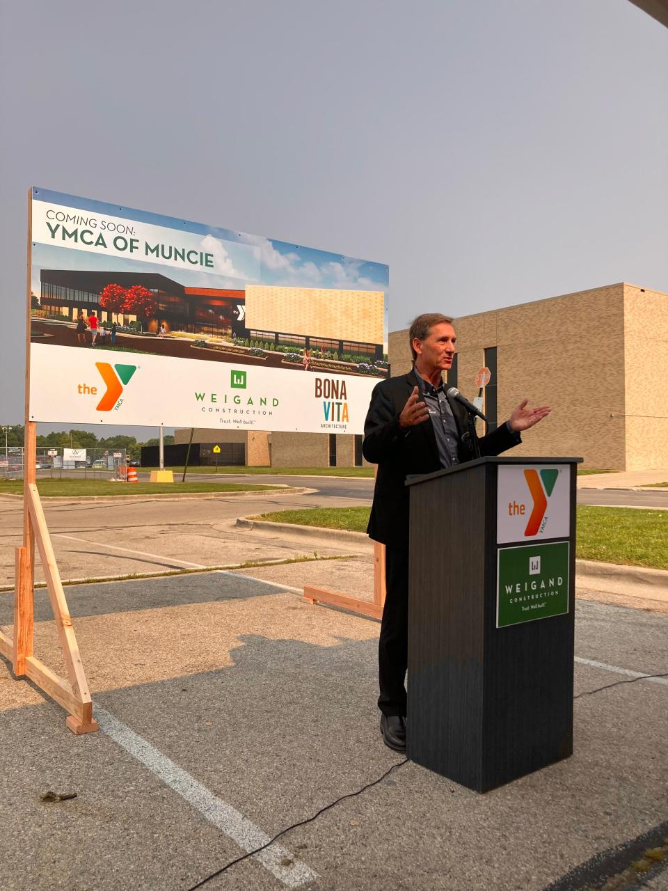 Muncie Mayor Dan Ridenour speaks at the groundbreaking ceremony for the new YMCA of Muncie facility located at the campus of Muncie Central High School. Ridenour said the new YMCA will be a catalyst for redevelopment of the McKinley neighborhood east of the planned YMCA. The facility is expected to be completed within about 18 months.