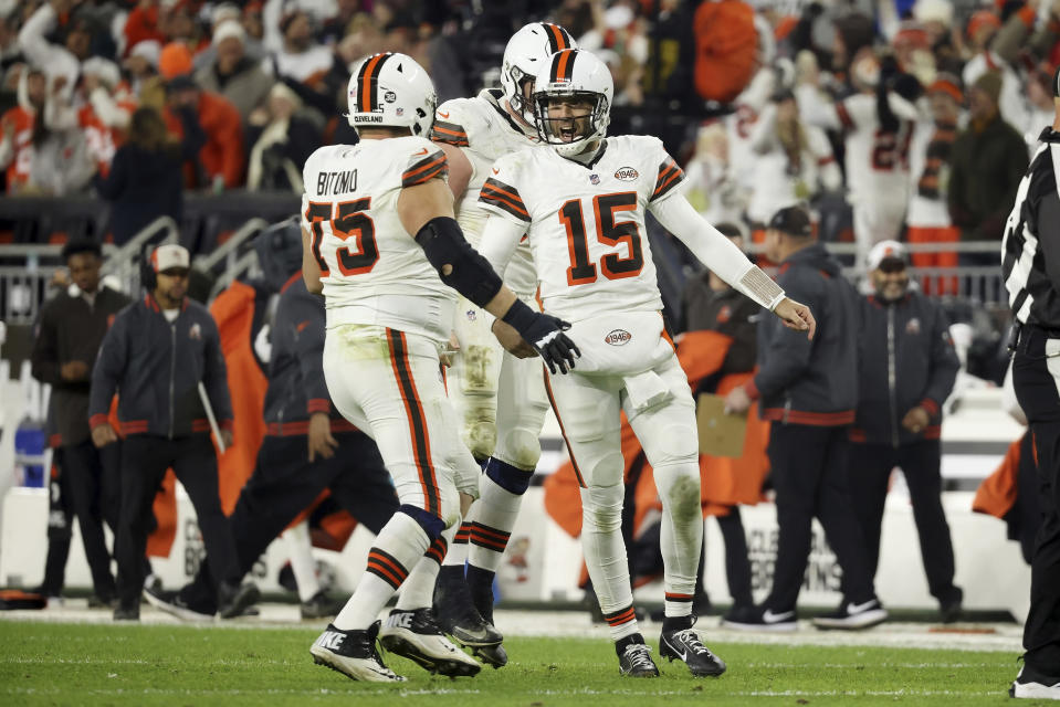 Cleveland Browns quarterback Joe Flacco (15) celebrates with guard Joel Bitonio (75) after throwing a pass for a touchdown during an NFL football game against the New York Jets, Thursday, Dec. 28, 2023, in Cleveland. (AP Photo/Kirk Irwin)