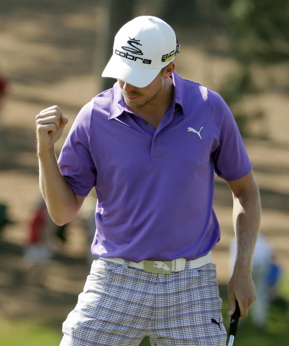 Jonas Blixt, of Sweden, pumps his fist after a birdie putt on the ninth hole during the third round of the Masters golf tournament Saturday, April 12, 2014, in Augusta, Ga. (AP Photo/Charlie Riedel)