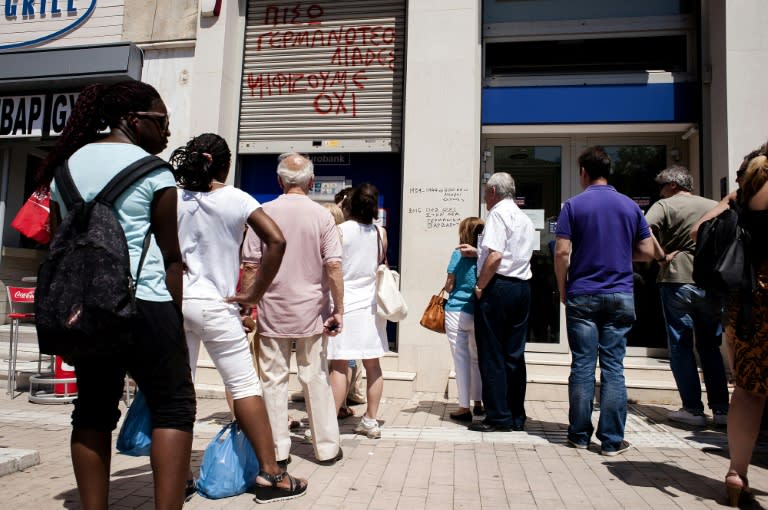 People queue outside a bank ATM in Athens, on July 6, 2015